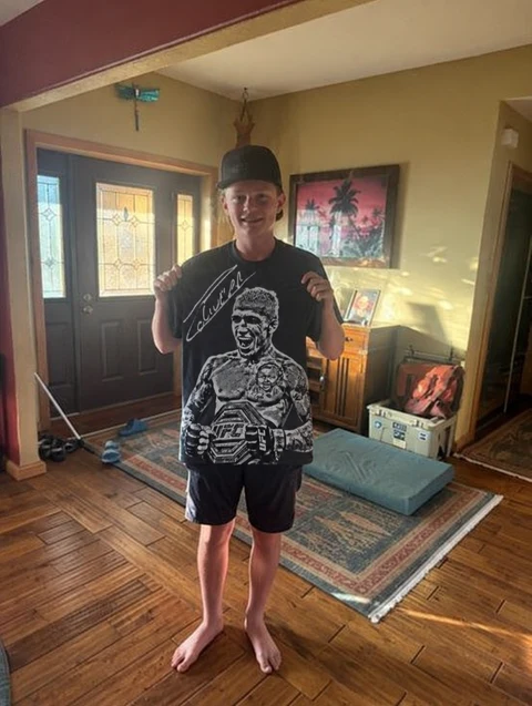 Real customer wearing the CHARLES OLIVEIRA tee
